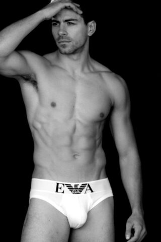 Lean, muscular male in his underwear, showcasing the results of proper nutrition and emphasizing the concept of Fitness from the Belly: Eating Right