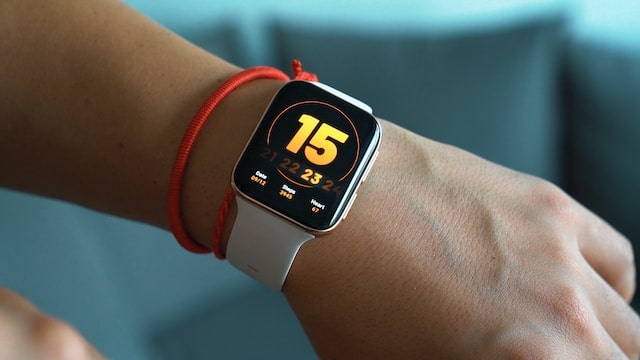 Close-up of a modern fitness watch snugly fit on a wrist, illustrating the merging of AI and Fitness: The Future of Training