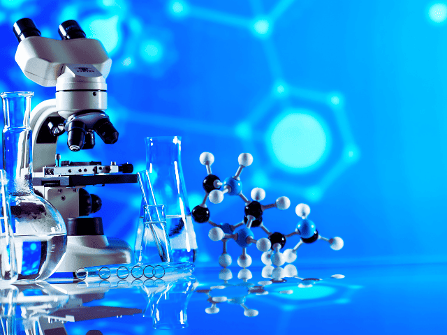 Image of a science lab featuring a microscope and a DNA model, symbolizing the scientific research behind the benefits of Farmer Carries